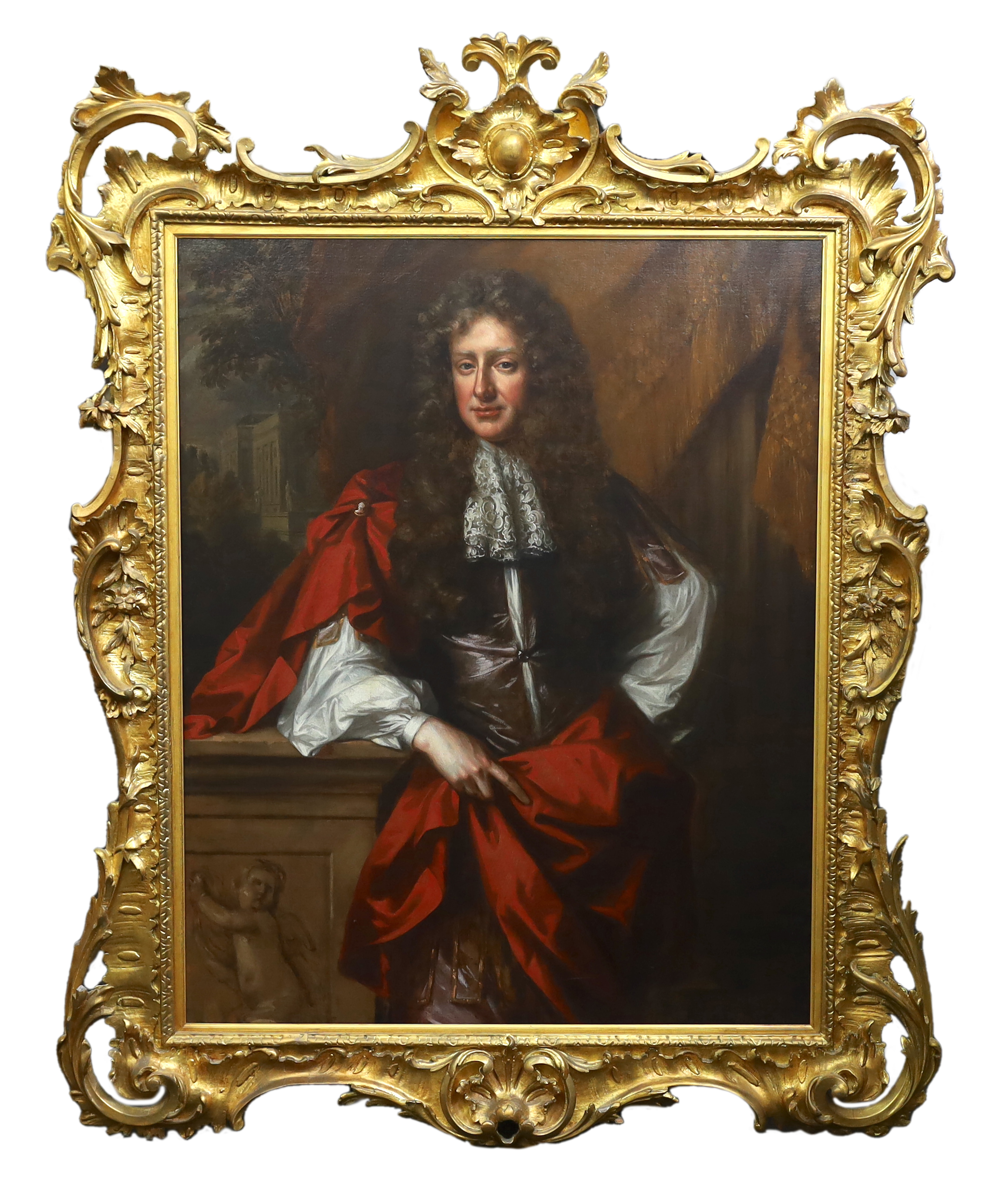 Follower of Willem Wissing (1656-1687), Portrait of a gentleman, three quarter length, in a brown waistcoat, lace jabot and crimson wrap, leaning on a stone pedestal, oil on canvas, 124 x 100cm, in a George III carved gi